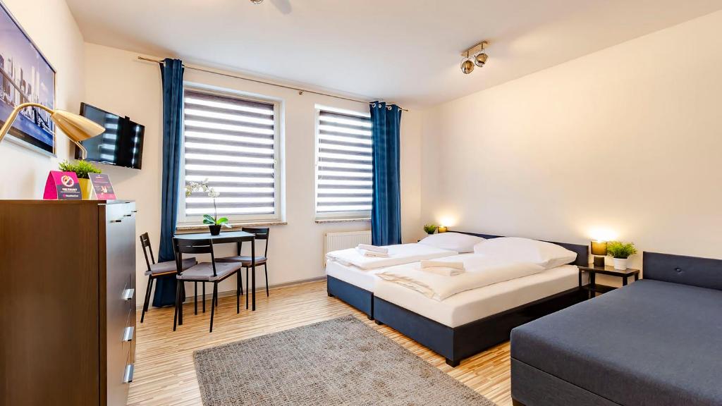 Posteľ alebo postele v izbe v ubytovaní VacationClub - Piłsudskiego 10B Apartament 2