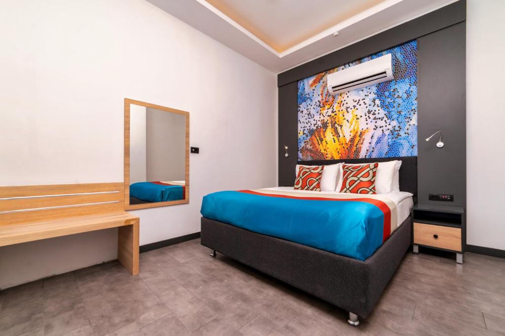 Postel nebo postele na pokoji v ubytování Optimum Luxury Hotel&Spa