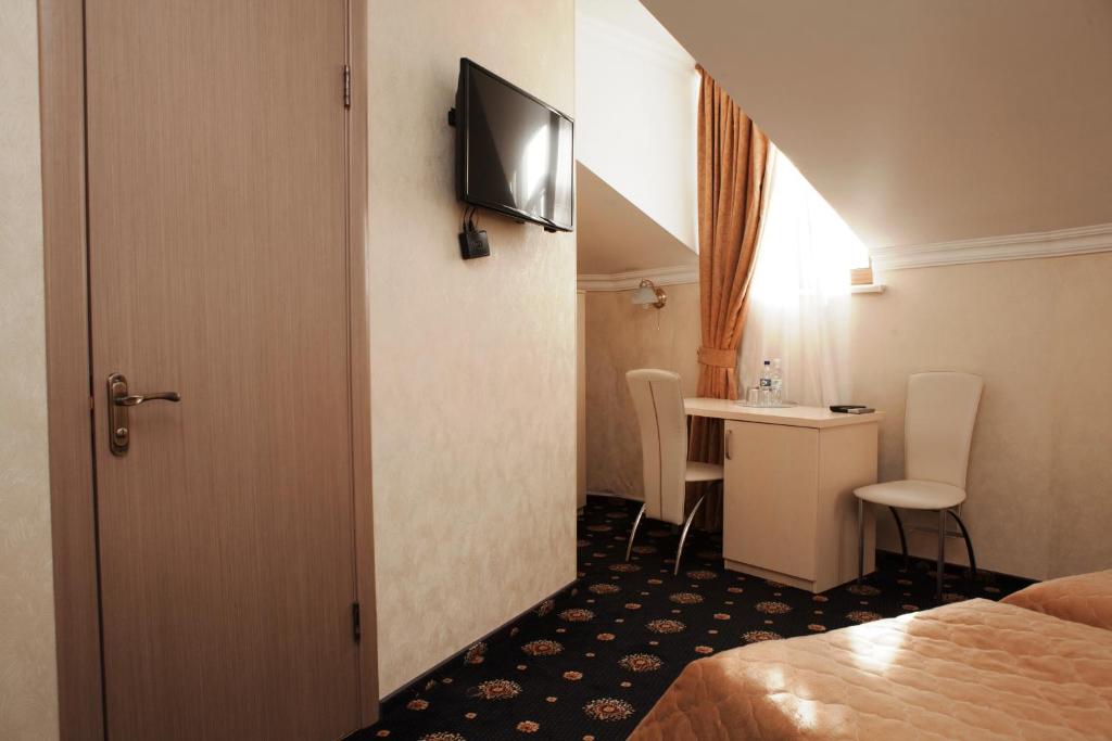 TV a/nebo společenská místnost v ubytování Gonchar Hotel