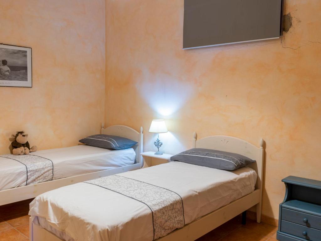 Łóżko lub łóżka w pokoju w obiekcie Villa Villa Bougainvillea by Interhome