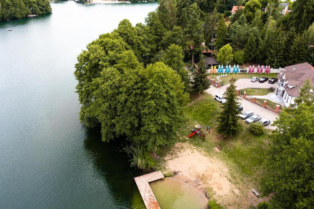 an aerial view of a body of water with trees at Przystanek Łagów in Łagów