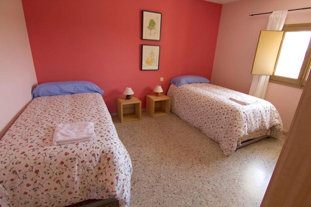 Postel nebo postele na pokoji v ubytování Casa Guaranatura alojamiento y barrancos