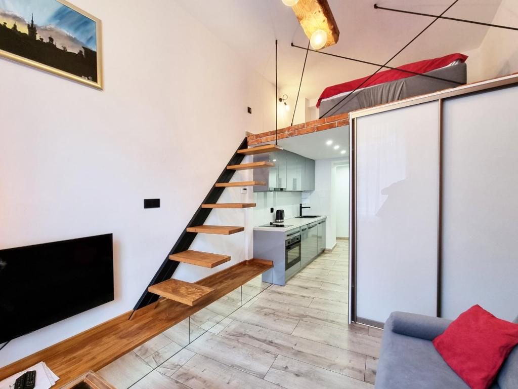 Televízia a/alebo spoločenská miestnosť v ubytovaní LOFT-to-be Apartment