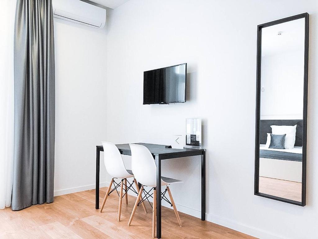 TV a/nebo společenská místnost v ubytování Klaster SeaView Hotel