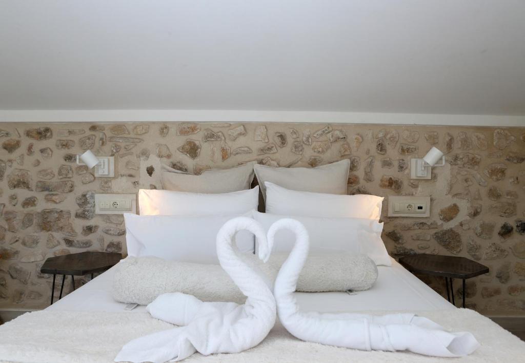 Postel nebo postele na pokoji v ubytování Nasilvana Hotel & Spa Adults Only