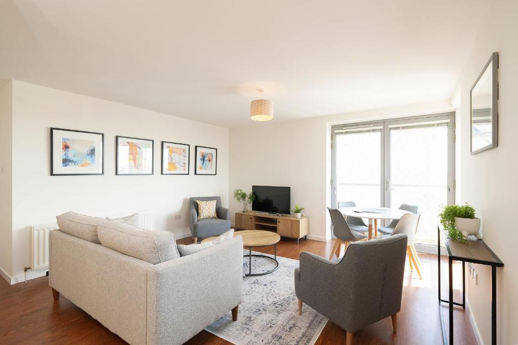 a living room with a couch and chairs and a table at At The Links in Carnoustie