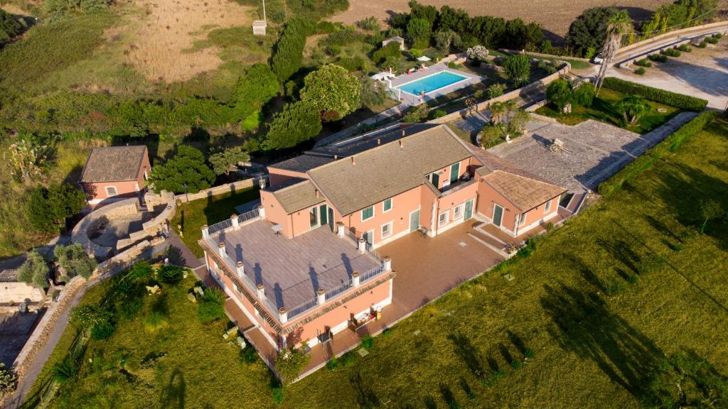 an aerial view of a large house with a swimming pool at Al Palmento Cruillas in Syracuse