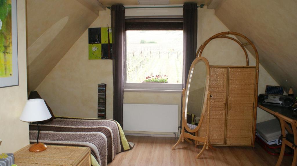 Postel nebo postele na pokoji v ubytování Chambre d'Hotes Le Vogelgarten