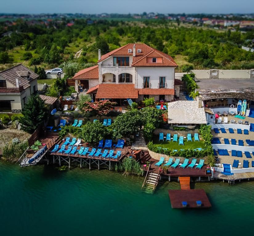an aerial view of a house on the water at Wellness apartmány Fürst in Nová Lipnica