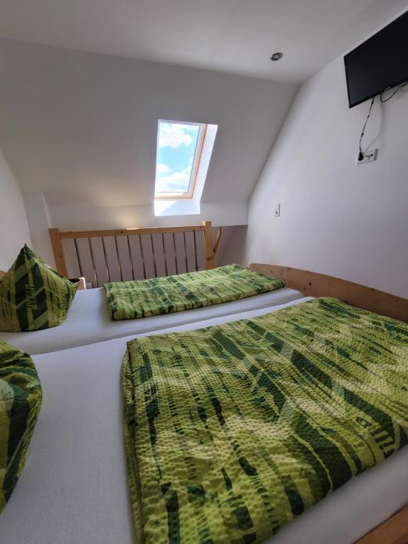 Postel nebo postele na pokoji v ubytování Rennsteigscheune