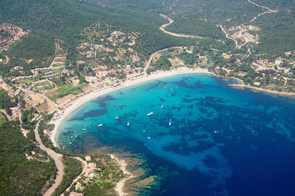 an aerial view of a beach and the ocean at Les Lodges de la Plage U Dragulinu in Sari Solenzara