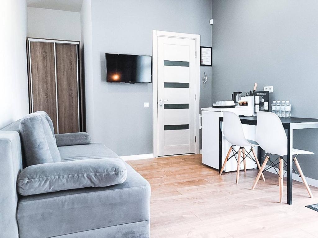 TV a/nebo společenská místnost v ubytování Klaster SeaView Hotel