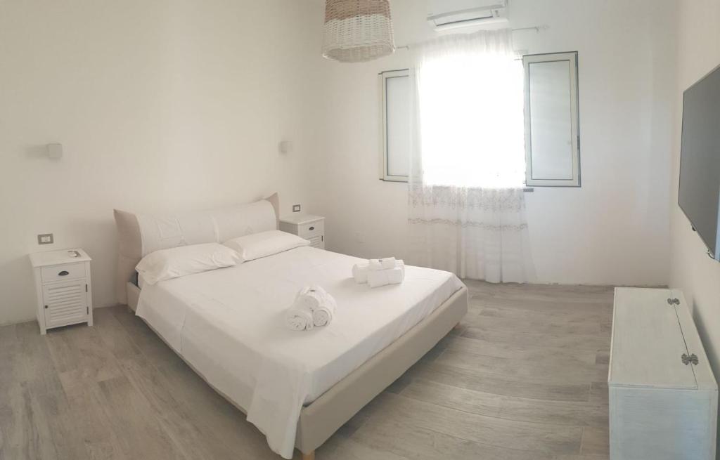 מיטה או מיטות בחדר ב-Elegant villa Graziosa Villetta I