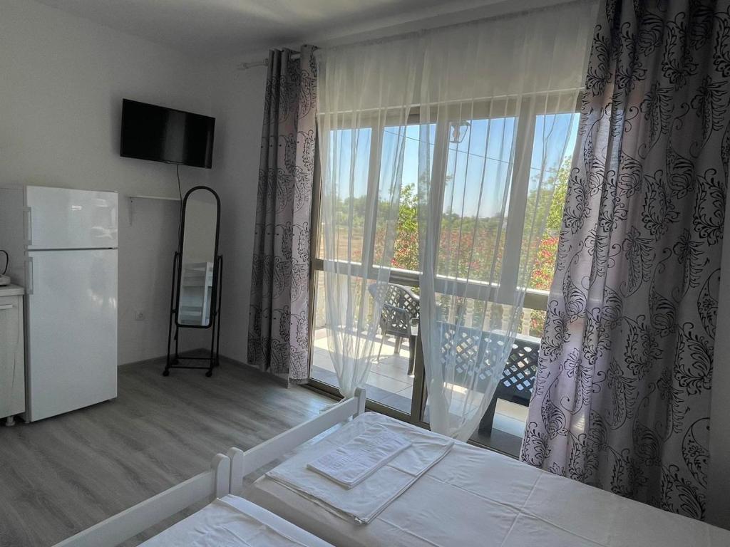 Postel nebo postele na pokoji v ubytování White apartments