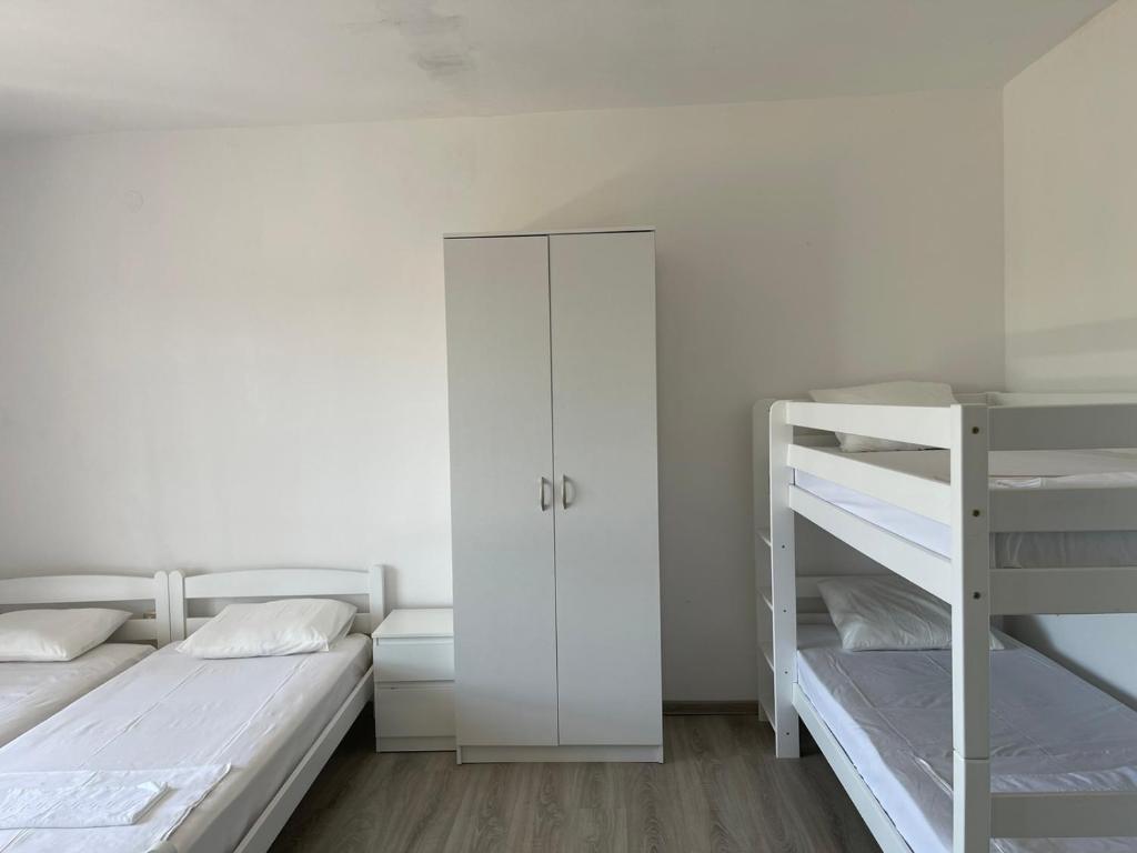 Postel nebo postele na pokoji v ubytování White apartments