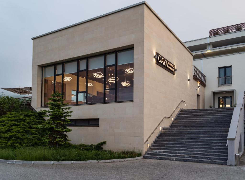 a building with stairs in front of it at Gaya Residences in Shahdag