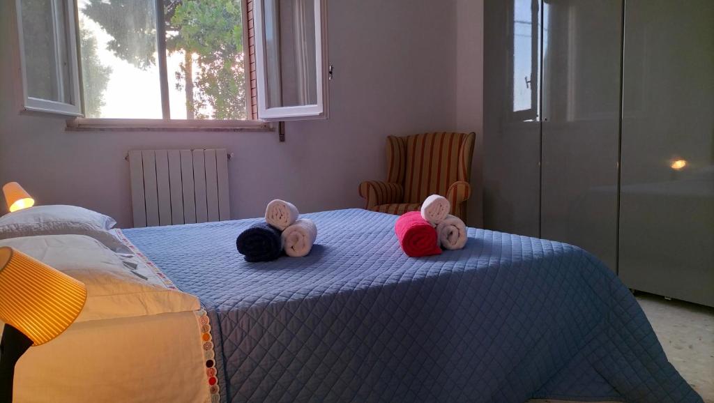 A bed or beds in a room at La Casa di Ludovica