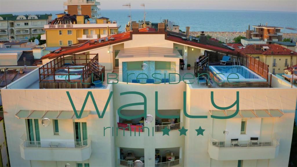 a building with a swimming pool on top of it at Wally Residence in Rimini