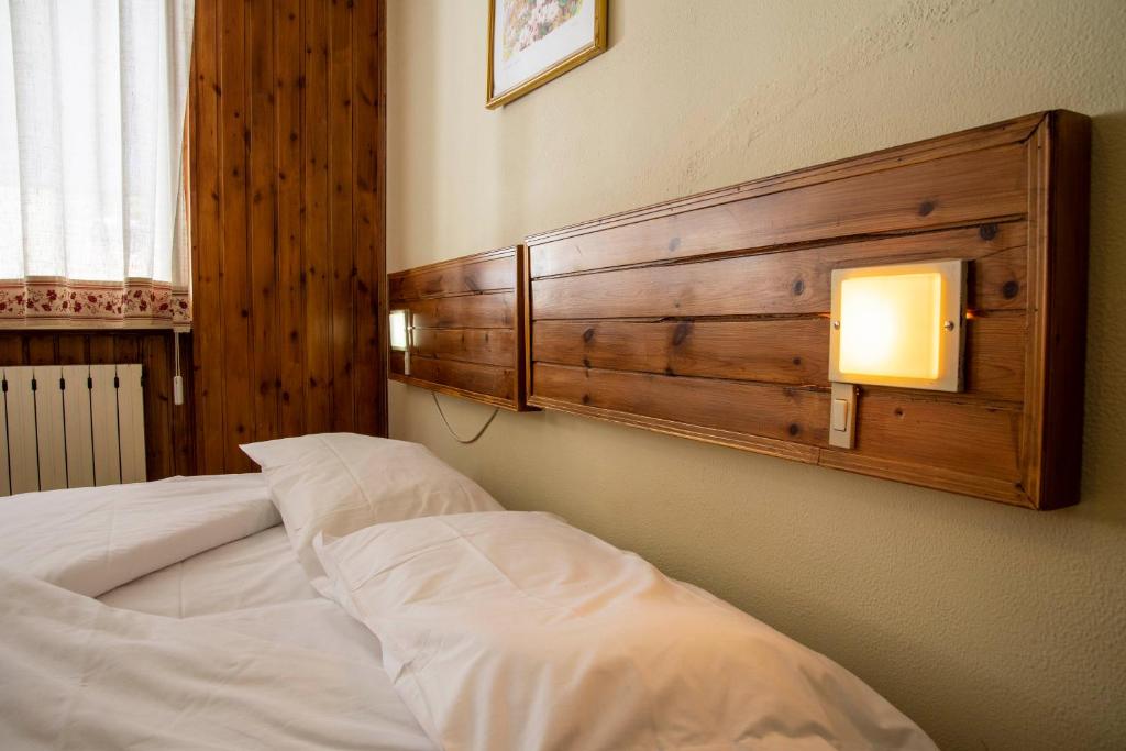 Postel nebo postele na pokoji v ubytování Residence Nube D'Argento