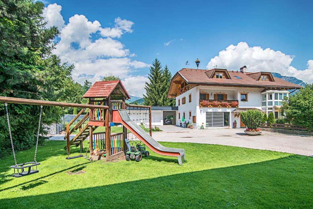 a playground in the yard of a house at Ferienhof Thumburg in Campo di Trens