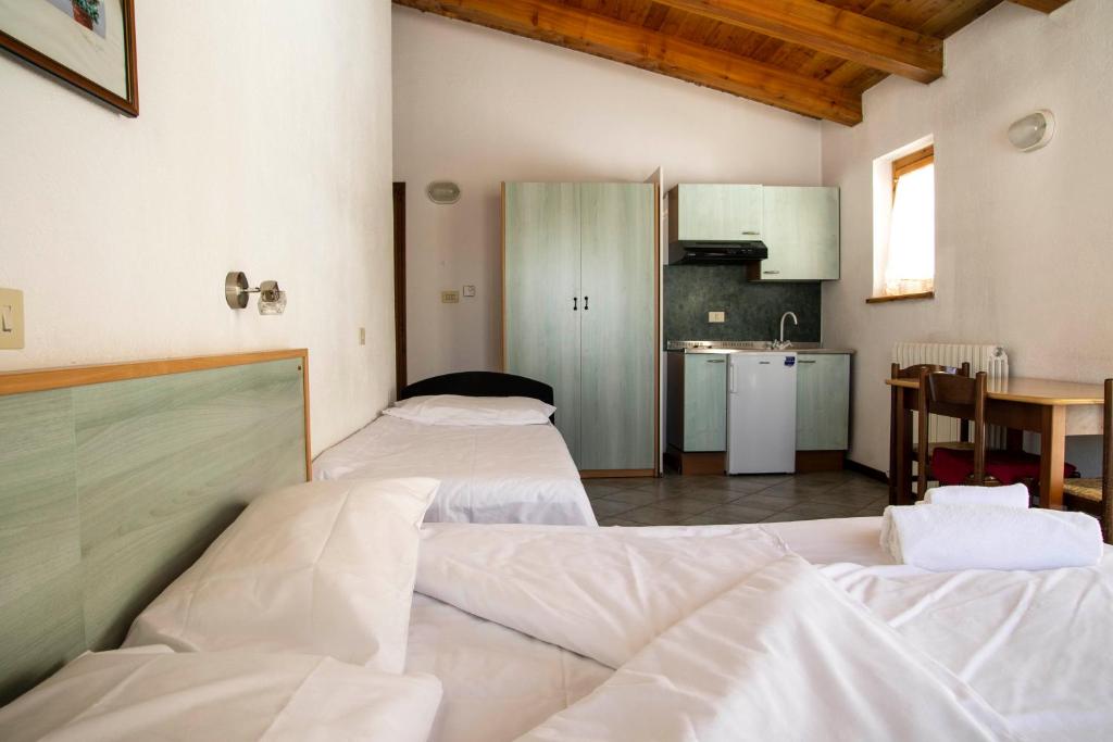 Postel nebo postele na pokoji v ubytování Residence Nube D'Argento