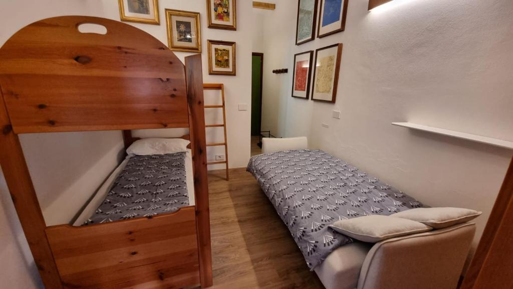 A bed or beds in a room at La Casa Degli Artisti - presso Sussy Residence