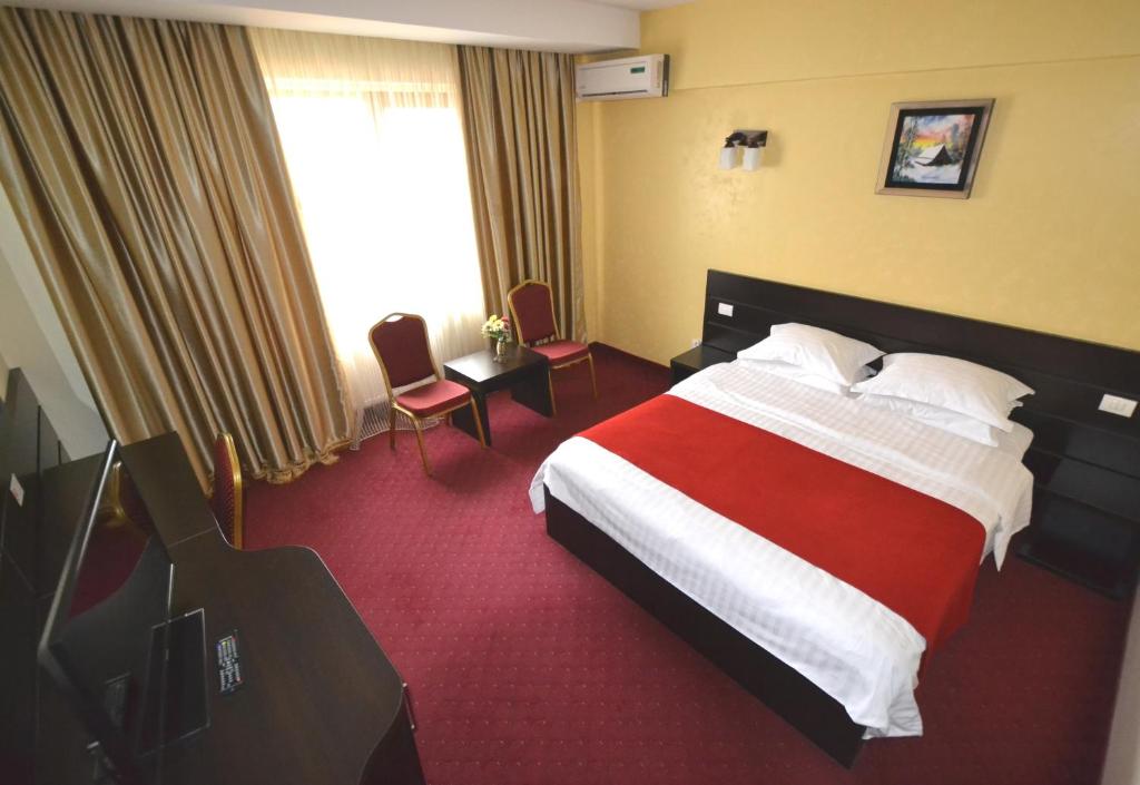 Postel nebo postele na pokoji v ubytování Hotel Ancor