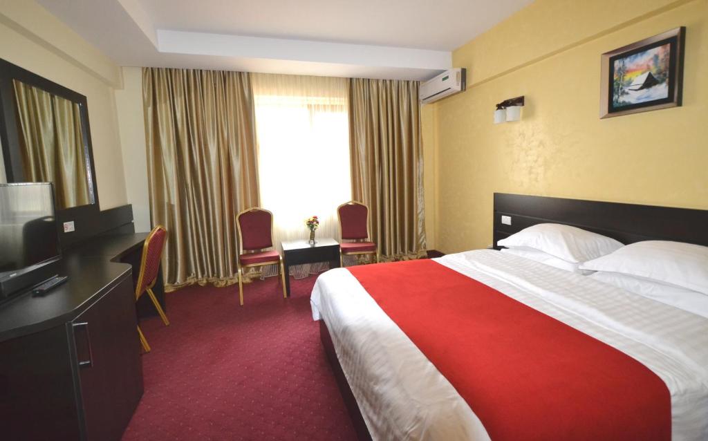 Postel nebo postele na pokoji v ubytování Hotel Ancor