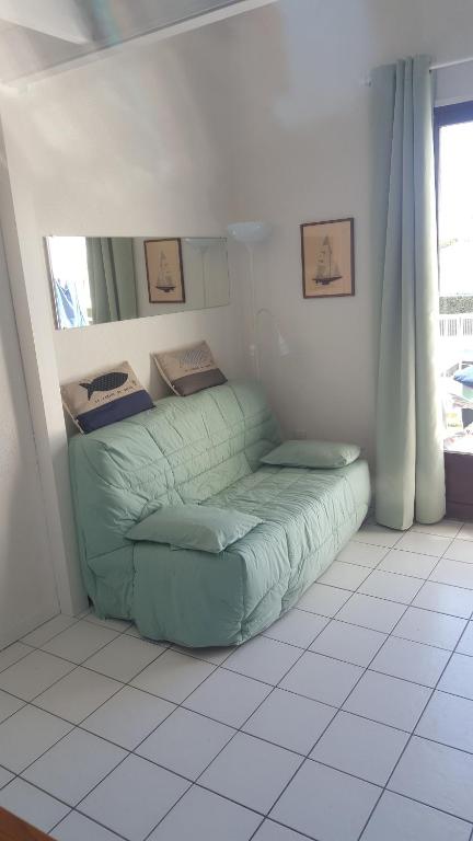 Una cama o camas en una habitaci&oacute;n de Appartement Vaux sur mer