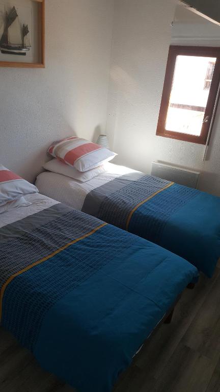 Una cama o camas en una habitaci&oacute;n de Appartement Vaux sur mer