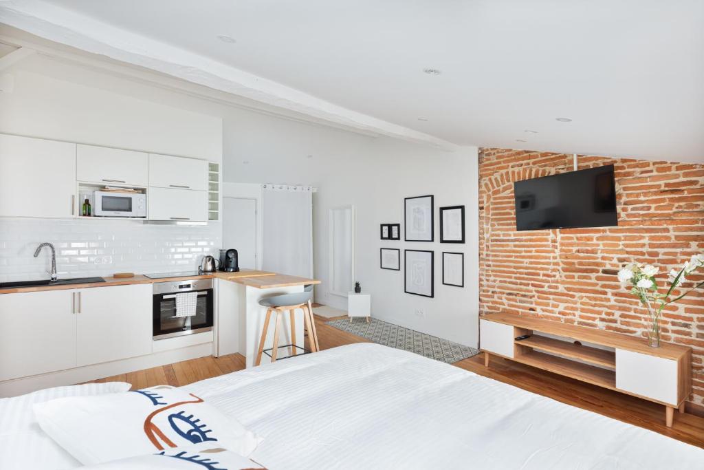 Kuchyňa alebo kuchynka v ubytovaní Le Cosy Spa & Office au cœur de Toulouse