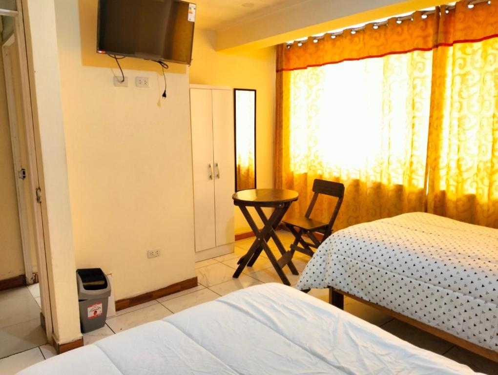 Postel nebo postele na pokoji v ubytování Hostal Ukumari Andino