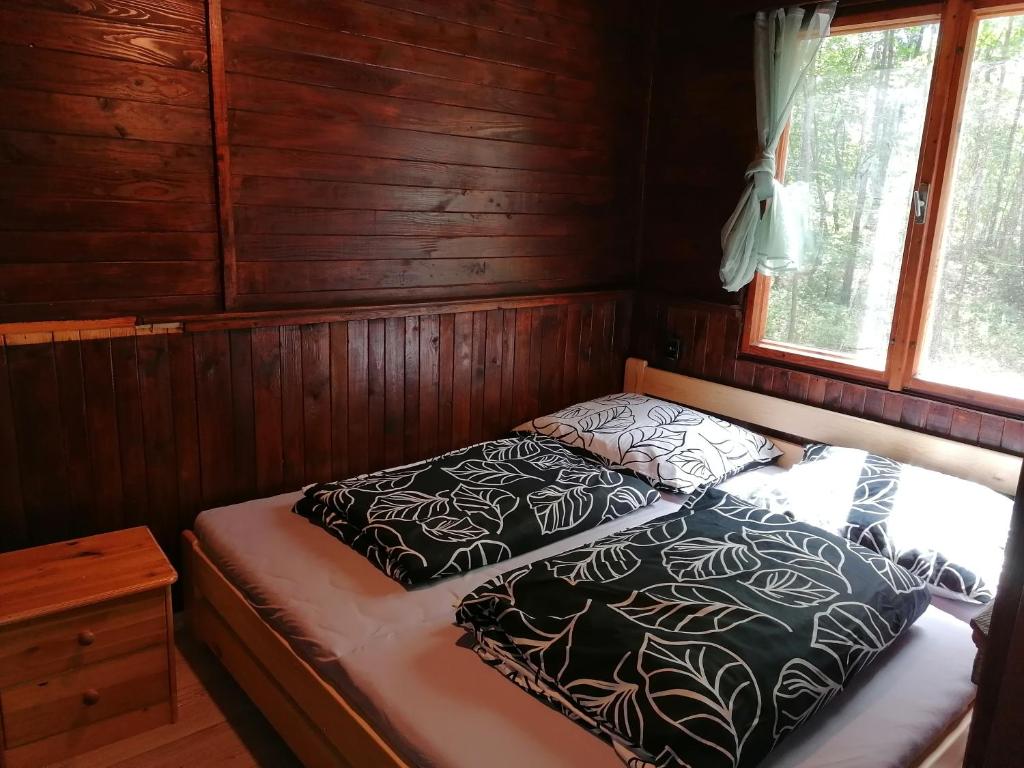 Postel nebo postele na pokoji v ubytování Chata Eliška