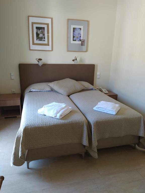 Postel nebo postele na pokoji v ubytování Ilios Hotel