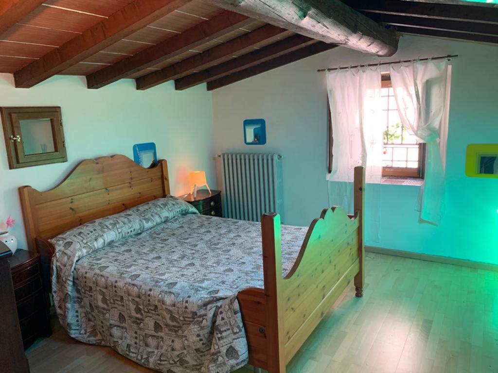 מיטה או מיטות בחדר ב-Le Mulina