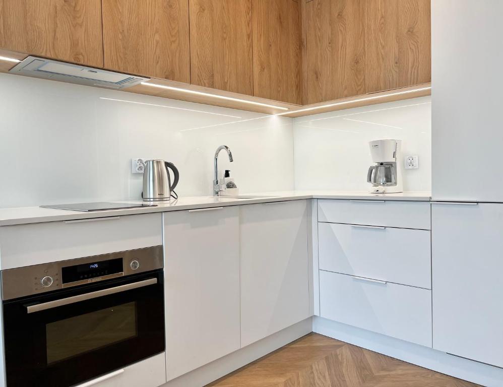Kuchyň nebo kuchyňský kout v ubytování Apartamenty Angielska Grobla Q4Apartments