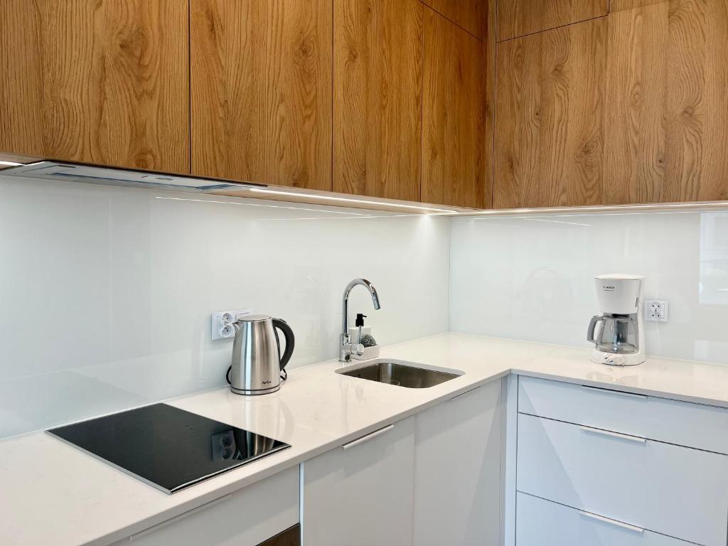 Kuchyň nebo kuchyňský kout v ubytování Apartamenty Angielska Grobla Q4Apartments