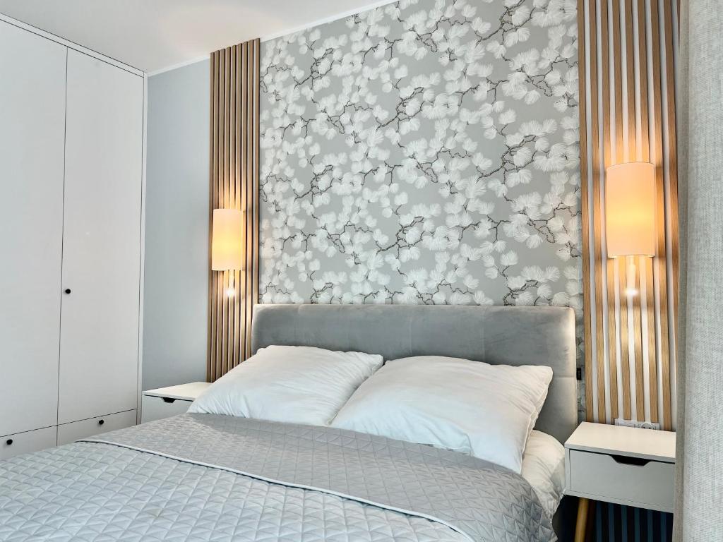 Postel nebo postele na pokoji v ubytování Apartamenty Angielska Grobla Q4Apartments