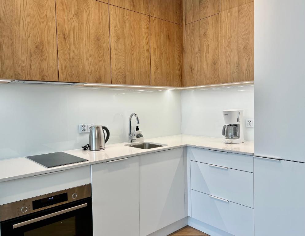 Kuchyň nebo kuchyňský kout v ubytování Apartamenty Angielska Grobla Q4Apartments