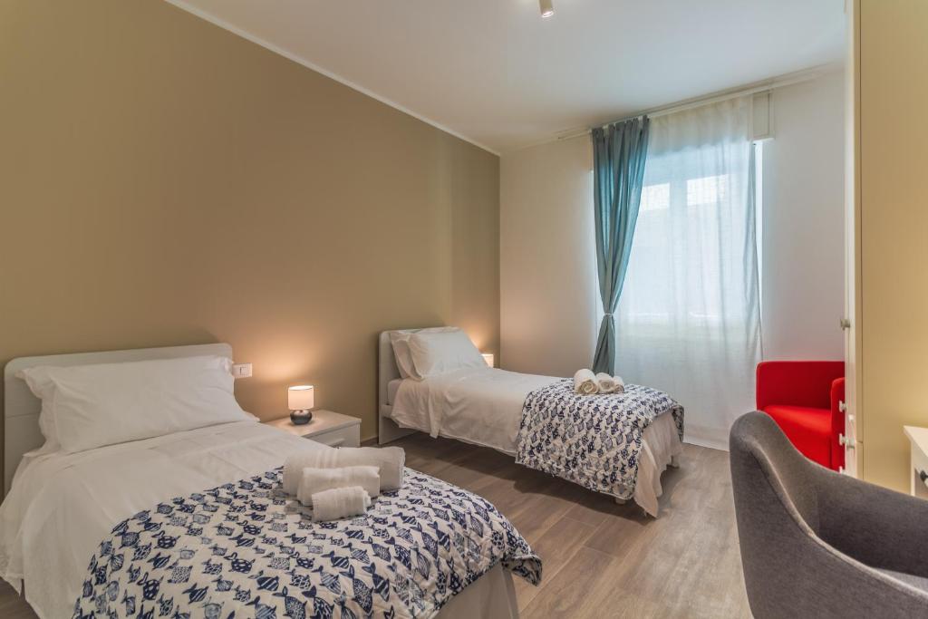 A bed or beds in a room at CASA VERA Tra storia, mare e comodità