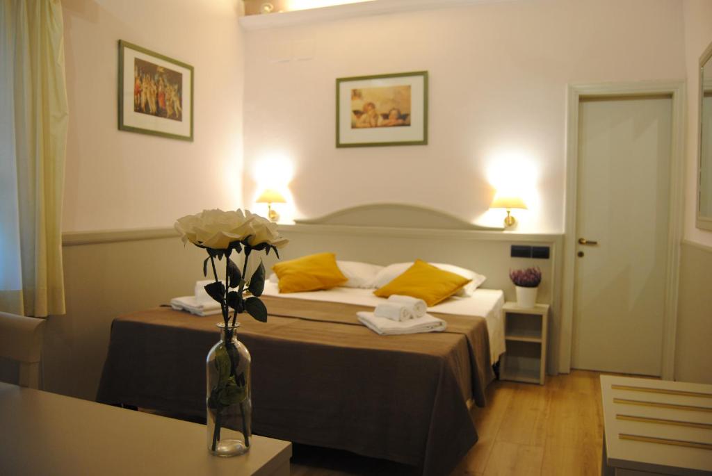 Katil atau katil-katil dalam bilik di Hotel Camilla Firenze