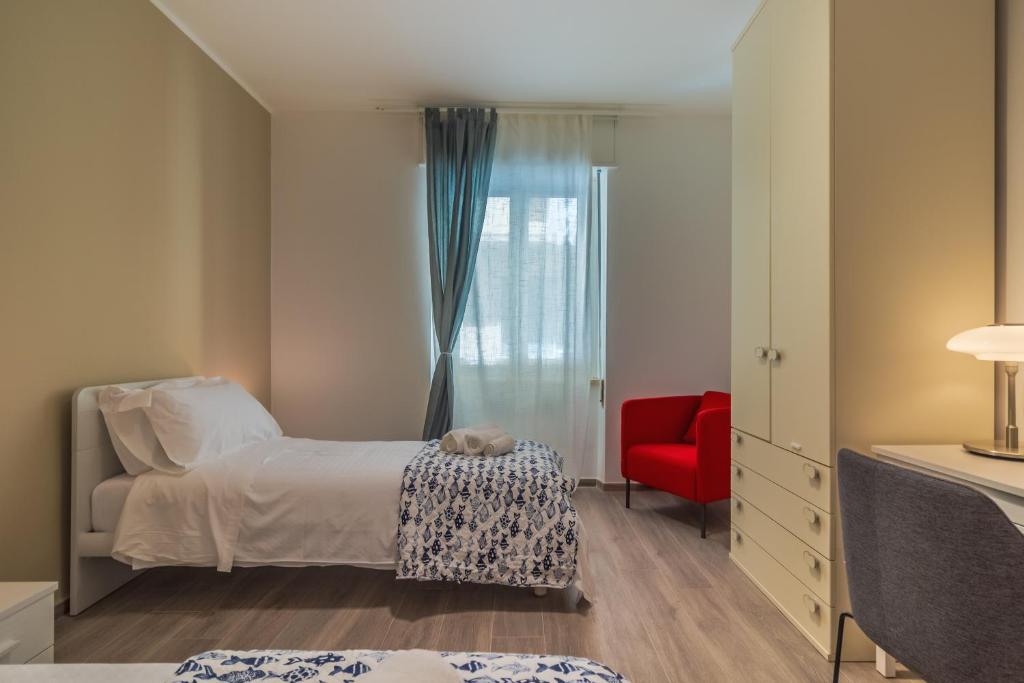 A bed or beds in a room at CASA VERA Tra storia, mare e comodità