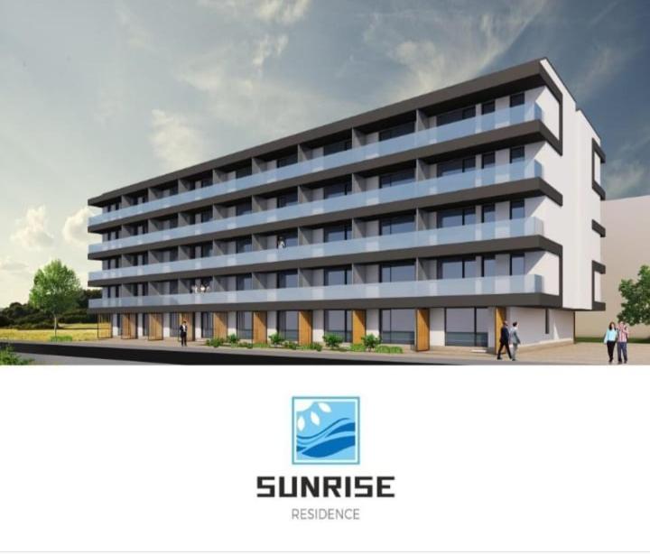 a rendering of a building with people walking in front of it at Apartament Alina Sunrise in Saturn