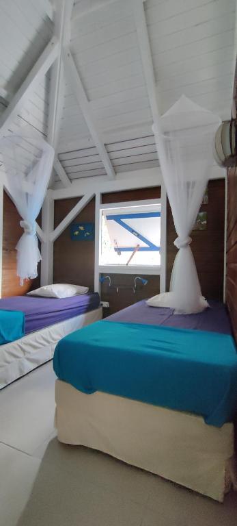 Postel nebo postele na pokoji v ubytování Habitation Colas