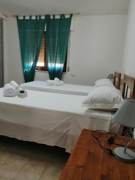 Letto o letti in una camera di Hotel Soleo