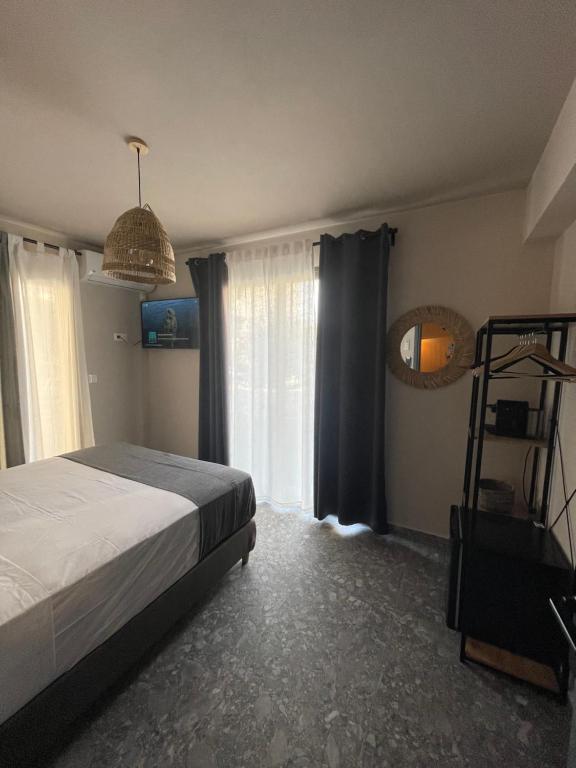 Postel nebo postele na pokoji v ubytování Istoria Boutique Hotel
