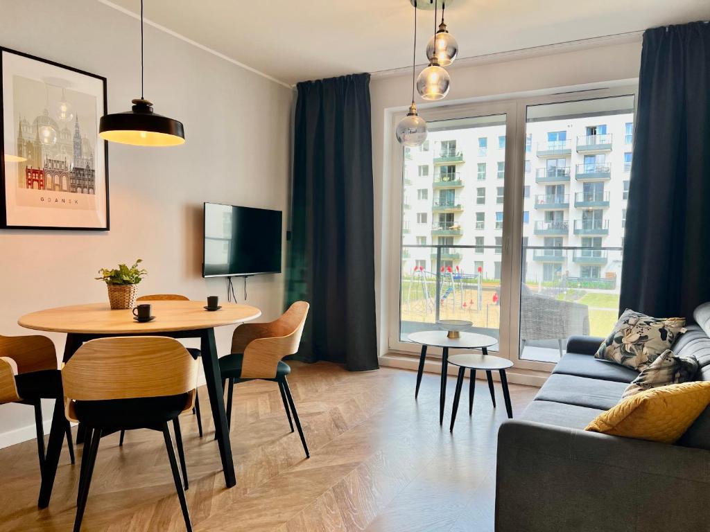 TV a/nebo společenská místnost v ubytování Apartamenty Angielska Grobla Q4Apartments