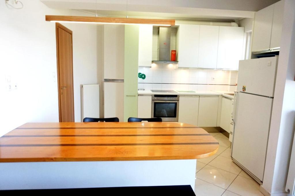 Kuchyň nebo kuchyňský kout v ubytování Piraeus Bright Apt