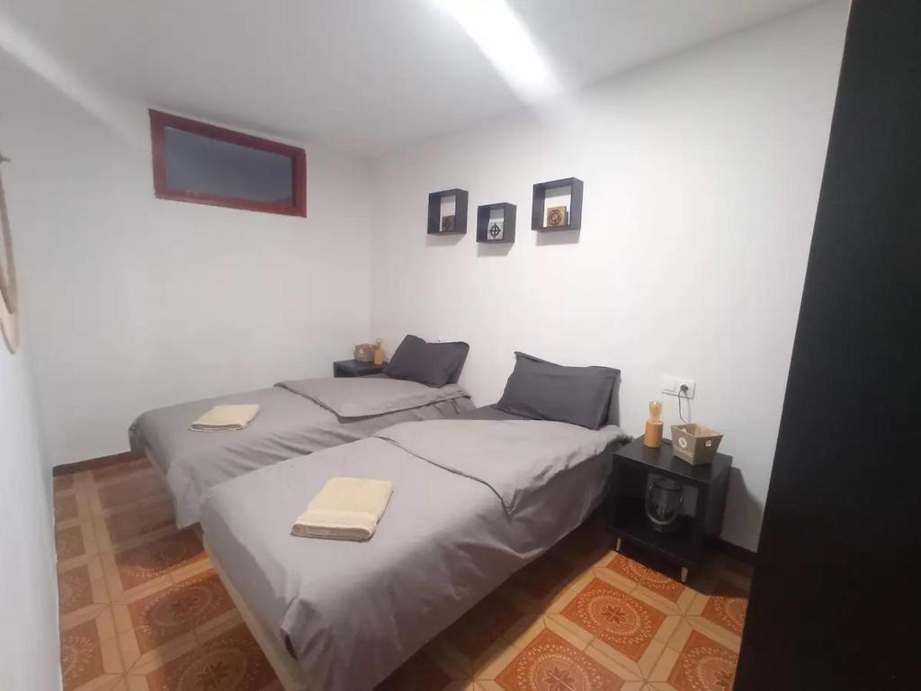 two beds in a room with white walls at Marblava 1 in Vinarós