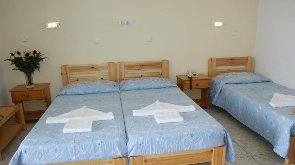 Postel nebo postele na pokoji v ubytování Hotel Zeus